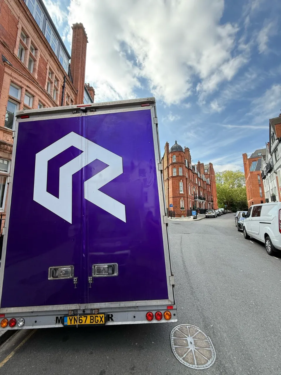 Rad Removals moving and storage van on the road ithrough Central London in Belgravia